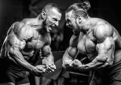 two_bodybuilders_pumping_up_muscles_workout_fitness_bodybuilding